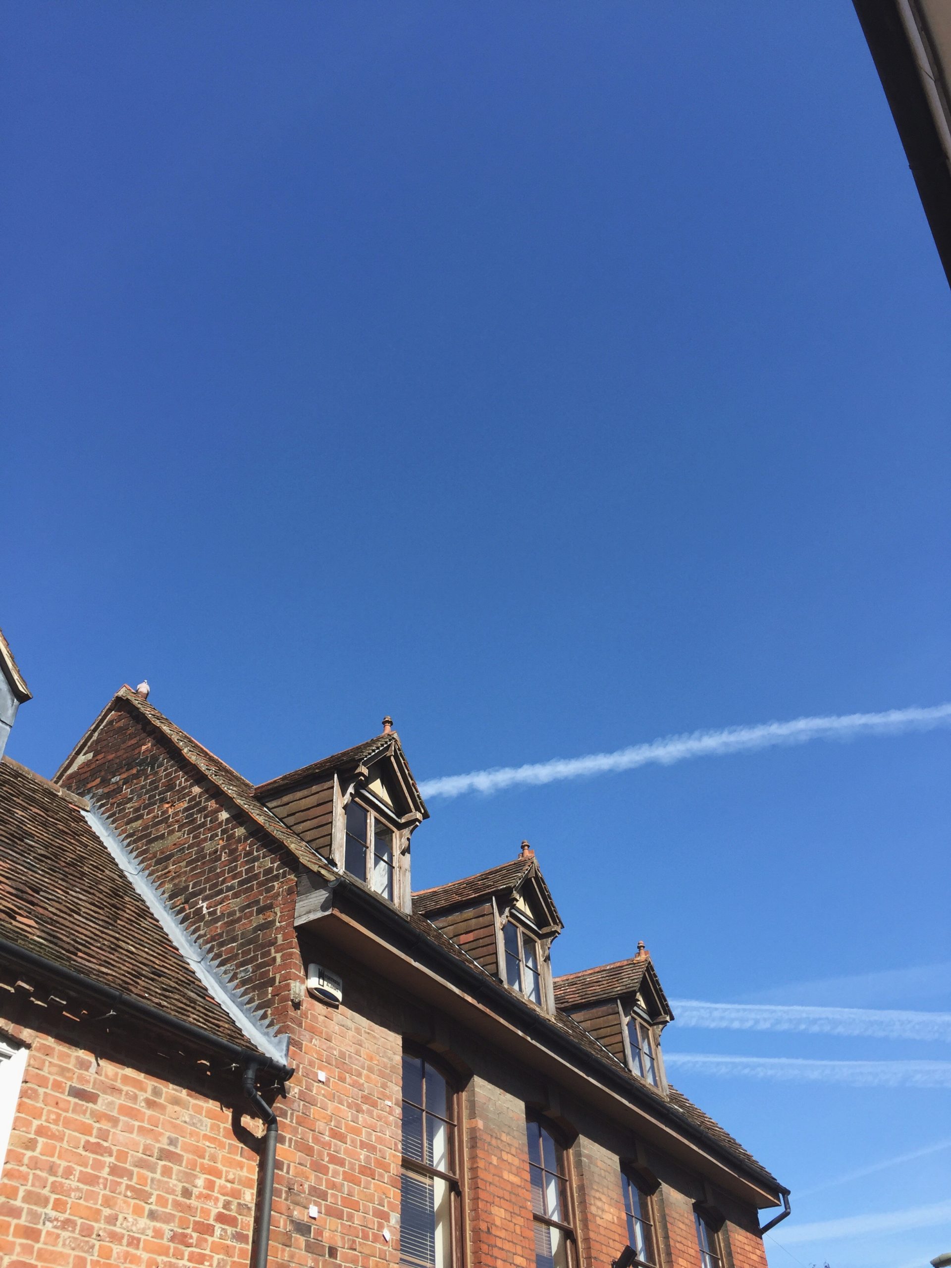 low-angle-view-building-against-blue-sky